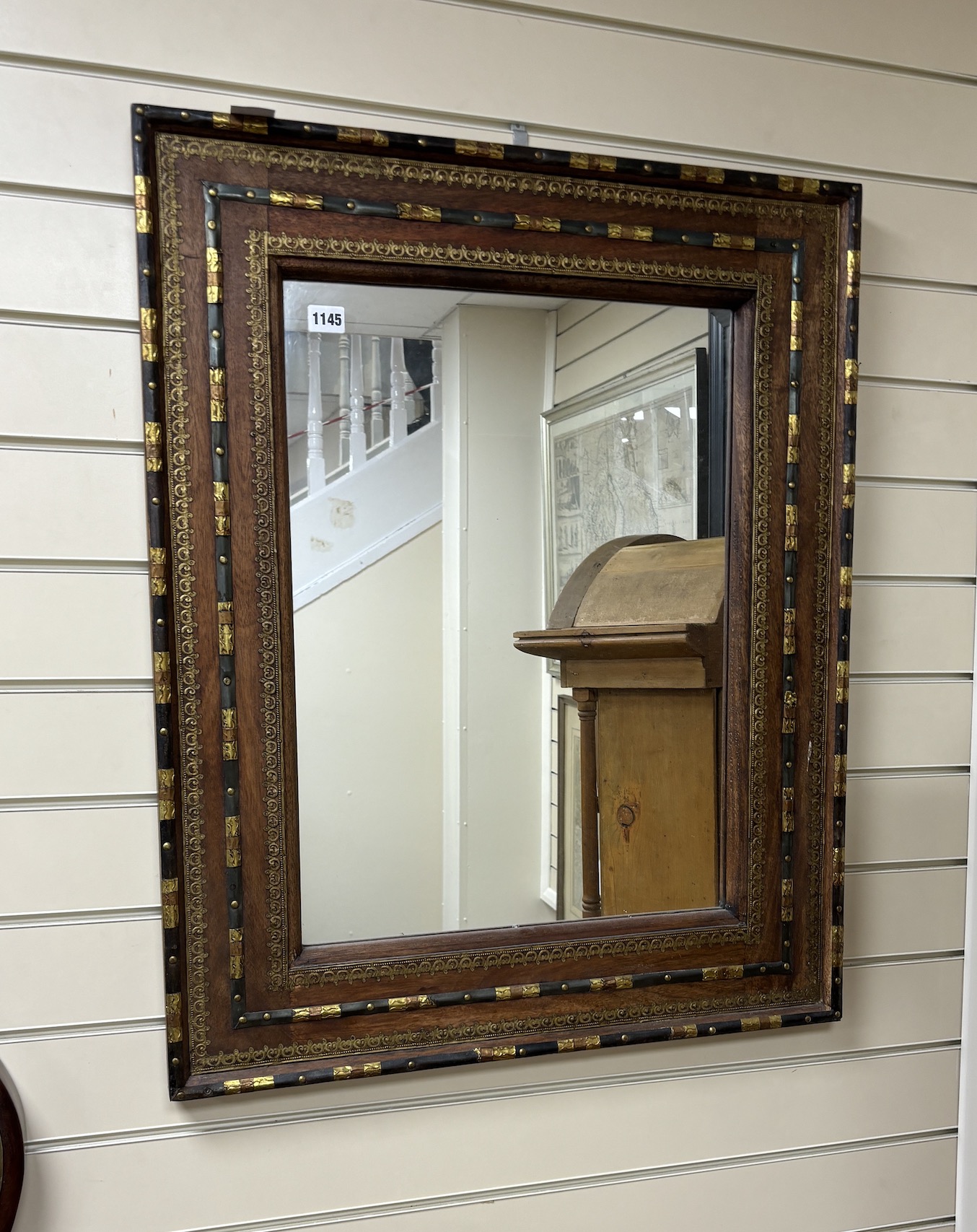 An Eastern brass mounted rectangular hardwood mirror, width 67cm, height 82cm.